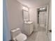 Bright bathroom with white vanity, sleek mirror, and tile flooring, providing a fresh feel at 2720 12Th Ave W, Bradenton, FL 34205