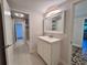 Bathroom featuring a white vanity, mirror, and doorway view to the shower at 2720 12Th Ave W, Bradenton, FL 34205