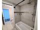 Updated bathroom featuring tiled shower with mosaic accents and modern fixtures at 2720 12Th Ave W, Bradenton, FL 34205