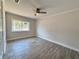 Inviting bedroom with a ceiling fan and large window providing ample natural light at 2720 12Th Ave W, Bradenton, FL 34205
