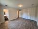 Bedroom features wood-look tile flooring, closet, and a bathroom at 2720 12Th Ave W, Bradenton, FL 34205