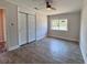 Comfortable bedroom with closet, ceiling fan, and window, providing a cozy space at 2720 12Th Ave W, Bradenton, FL 34205