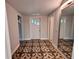 Entryway with decorative tile flooring, mirror, and neutral walls at 2720 12Th Ave W, Bradenton, FL 34205