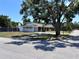 Full view of the home from the street, revealing a well-kept lawn at 2720 12Th Ave W, Bradenton, FL 34205