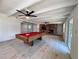 Spacious game room with wood beam ceiling, billiards table and brick fireplace at 2720 12Th Ave W, Bradenton, FL 34205