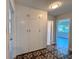 Hallway featuring built-in cupboard for ample storage and easy access to other rooms at 2720 12Th Ave W, Bradenton, FL 34205