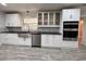Kitchen boasts stainless steel appliances, a farmhouse sink, and white cabinets, offering a modern, clean aesthetic at 2720 12Th Ave W, Bradenton, FL 34205
