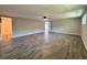 Large living room with tile flooring, ceiling fan, and natural light at 2720 12Th Ave W, Bradenton, FL 34205