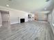Expansive living area featuring wood-look floors, recessed lighting and open layout at 2720 12Th Ave W, Bradenton, FL 34205