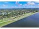 Scenic aerial view features the community, running path, and river at 2816 Breton Woods, Sarasota, FL 34235