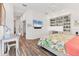 Bedroom featuring a white walls, TV, and built-in shelves, complete with a view of the outside at 2816 Breton Woods, Sarasota, FL 34235