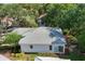 Bird's eye view of home featuring tile roof, sliding glass doors, and neatly landscaped yard at 2816 Breton Woods, Sarasota, FL 34235