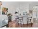 Modern kitchen features granite countertops, white cabinetry, and stainless appliances at 2816 Breton Woods, Sarasota, FL 34235