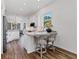 Updated kitchen features granite countertops, pendant lighting, and stainless appliances at 2816 Breton Woods, Sarasota, FL 34235