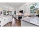 Modern kitchen with granite countertops, stainless appliances, and ample storage at 2816 Breton Woods, Sarasota, FL 34235