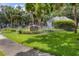 Community sign for Stratfield Park, surrounded by lush landscaping and mature trees at 2816 Breton Woods, Sarasota, FL 34235