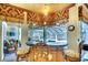 Charming bar area with custom wood finishes and seating, perfect for entertaining guests by the pool at 2901 Little Country Rd, Parrish, FL 34219