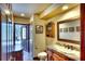 Elegant bathroom with granite counters, stylish vanity, and decorative accents at 2901 Little Country Rd, Parrish, FL 34219