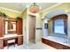 Spacious bathroom with double vanity, walk-in shower, and a luxurious soaking tub at 2901 Little Country Rd, Parrish, FL 34219