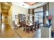 Dining room with tiled flooring, elegant decor and furnishings, and a large bay window for natural light at 2901 Little Country Rd, Parrish, FL 34219