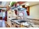 Custom kitchen boasts professional grade appliances and stone countertops at 2901 Little Country Rd, Parrish, FL 34219