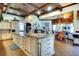 Open kitchen with granite counters, custom cabinets, and stainless steel appliances at 2901 Little Country Rd, Parrish, FL 34219