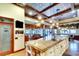 Large kitchen with custom cabinets, granite counters, a butler's pantry and views of the outdoor space at 2901 Little Country Rd, Parrish, FL 34219