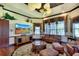 Bright living room with plush seating, a decorative rug, and a large-screen TV at 2901 Little Country Rd, Parrish, FL 34219