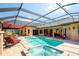 Screened pool and spa with brick patio, outdoor bar, and ample seating at 2901 Little Country Rd, Parrish, FL 34219