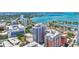 Stunning aerial view of the modern high-rise condo with waterfront views and downtown cityscape at 33 S Palm Ave # 1101, Sarasota, FL 34236
