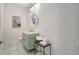 Stylish powder room featuring a light green vanity and marble floors at 33 S Palm Ave # 1101, Sarasota, FL 34236