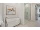 Modern bathroom featuring free standing tub and glass enclosed shower at 33 S Palm Ave # 1101, Sarasota, FL 34236
