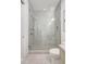 Shower with sleek glass door and chrome fixtures in a contemporary bathroom at 33 S Palm Ave # 1101, Sarasota, FL 34236