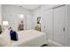Well-lit bedroom with ensuite bathroom and sliding-door closet shows a calm and inviting interior at 33 S Palm Ave # 1101, Sarasota, FL 34236