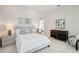 Comfortable bedroom with neutral colors and furnishings. Two windows let in lots of light at 33 S Palm Ave # 1101, Sarasota, FL 34236