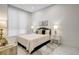 Bright bedroom features a comfortable bed, bedside tables with lamps, and a modern aesthetic at 33 S Palm Ave # 1101, Sarasota, FL 34236