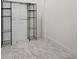 Walk-in closet features metal shelving and marble floors, offering ample storage space and a modern aesthetic at 33 S Palm Ave # 1101, Sarasota, FL 34236