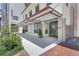 Charming building exterior featuring an awning, inviting storefront, and landscaped surroundings at 33 S Palm Ave # 1101, Sarasota, FL 34236