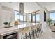Modern kitchen featuring a large island, sleek appliances, and ample counter space with seating at 33 S Palm Ave # 1101, Sarasota, FL 34236