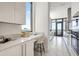 Bright, stylish kitchen featuring modern countertops, white cabinets, and a great view from a large window at 33 S Palm Ave # 1101, Sarasota, FL 34236