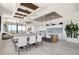 Beautiful dining and kitchen area features an island, wooden cabinets, and pendant lighting at 33 S Palm Ave # 1101, Sarasota, FL 34236