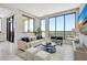 Bright living room with water view features modern decor and marble tile flooring at 33 S Palm Ave # 1101, Sarasota, FL 34236