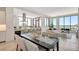 Bright, open-concept living space with modern finishes, floor-to-ceiling windows and water views at 33 S Palm Ave # 1101, Sarasota, FL 34236