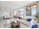 Open concept living room, dining area and kitchen with marble tile floors at 33 S Palm Ave # 1101, Sarasota, FL 34236