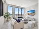Bright living room features floor-to-ceiling windows and views of the city and harbor at 33 S Palm Ave # 1101, Sarasota, FL 34236