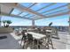 Rooftop deck featuring dining sets and ocean view at 33 S Palm Ave # 1101, Sarasota, FL 34236