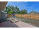 Large backyard with patio, playset, sandbox, shed, and tall wood fence for privacy at 3417 49Th W St, Bradenton, FL 34209