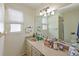 Neutral bathroom featuring a large mirror, vanity, and plenty of counter space at 3417 49Th W St, Bradenton, FL 34209