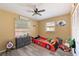 room featuring a car-themed bed, neutral walls, natural light, and laminate flooring at 3417 49Th W St, Bradenton, FL 34209