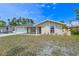 Charming single-story home with a well-maintained lawn and a welcoming front porch. Spacious driveway and 1-car garage at 3417 49Th W St, Bradenton, FL 34209